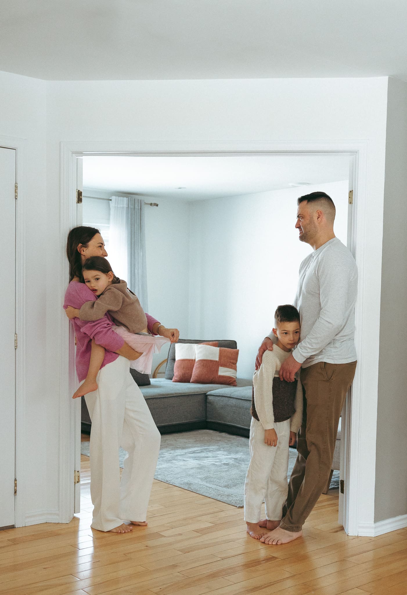 family standing in the home during a lifestyle family photoshoot