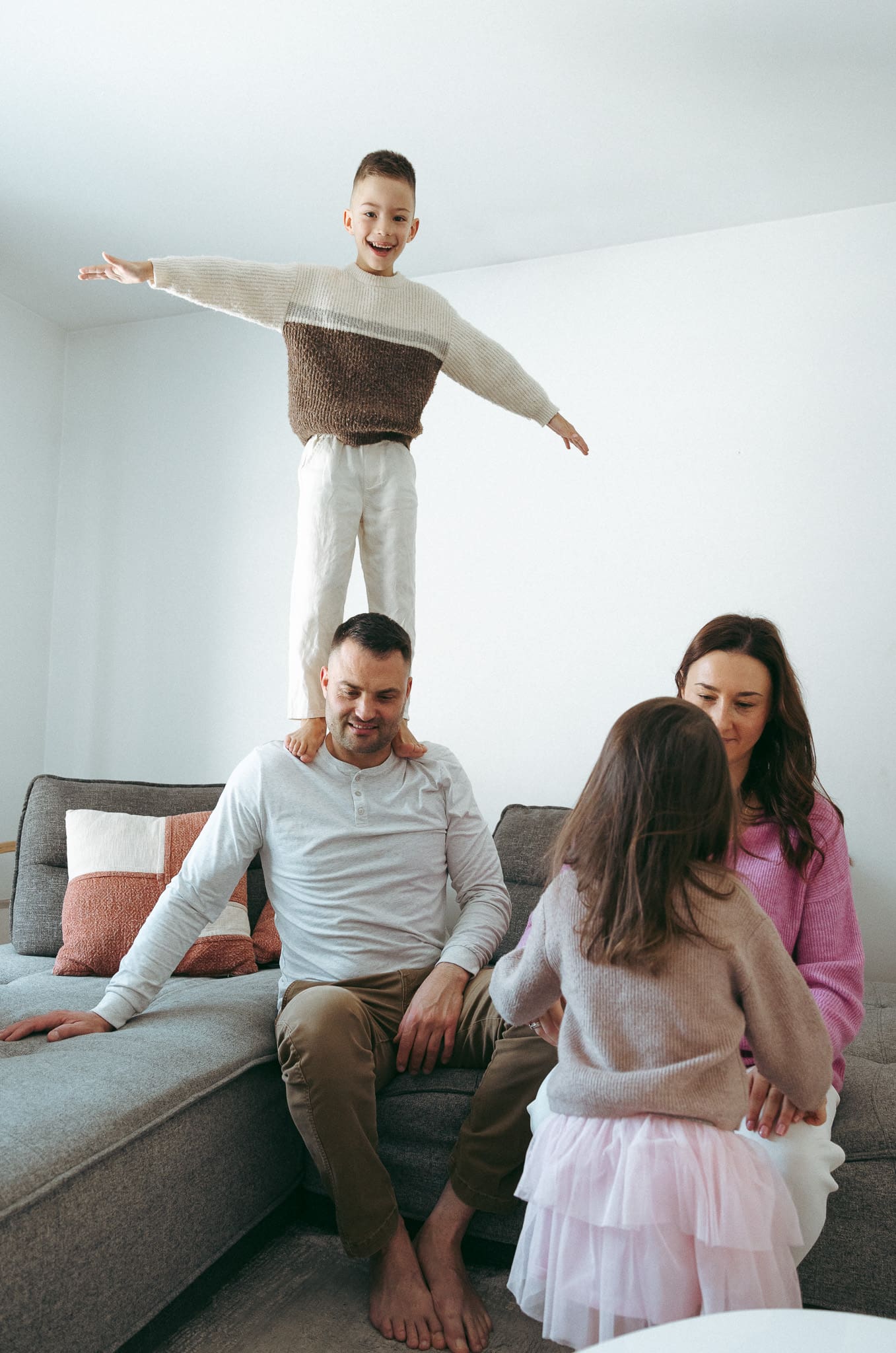 family having fun in the living room for a lifestyle family photoshoot