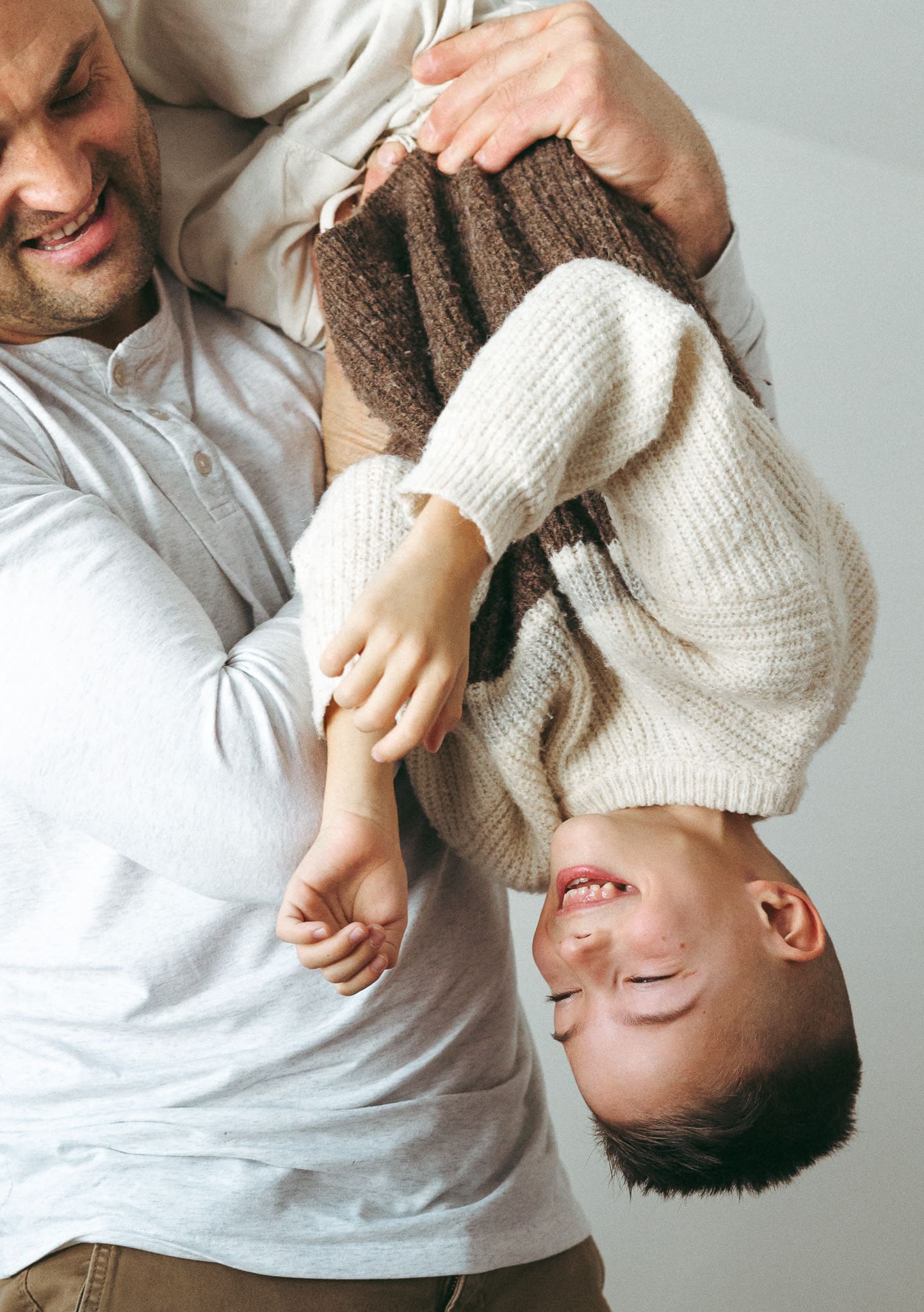 father and son playing during a storytelling photoshoot