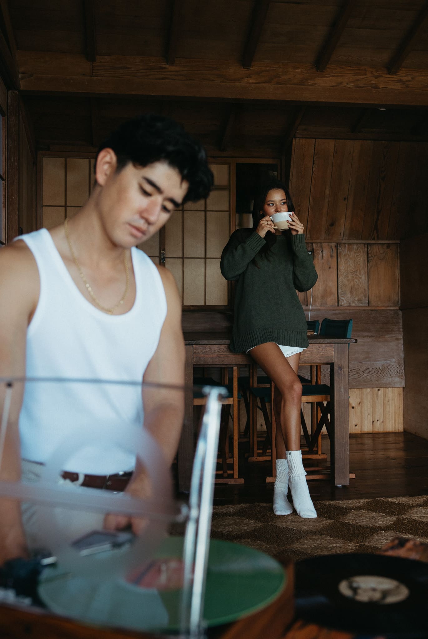 a couple playing music and drinking coffee for a couples session 
