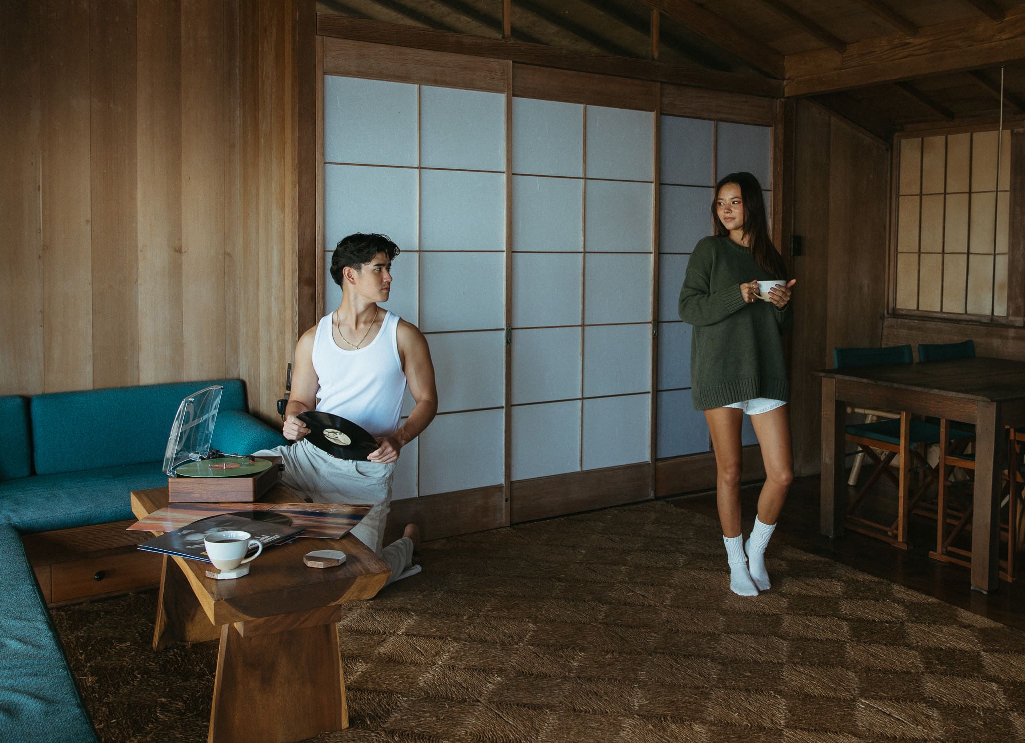 a couple playing records and drinking coffee for a couples session