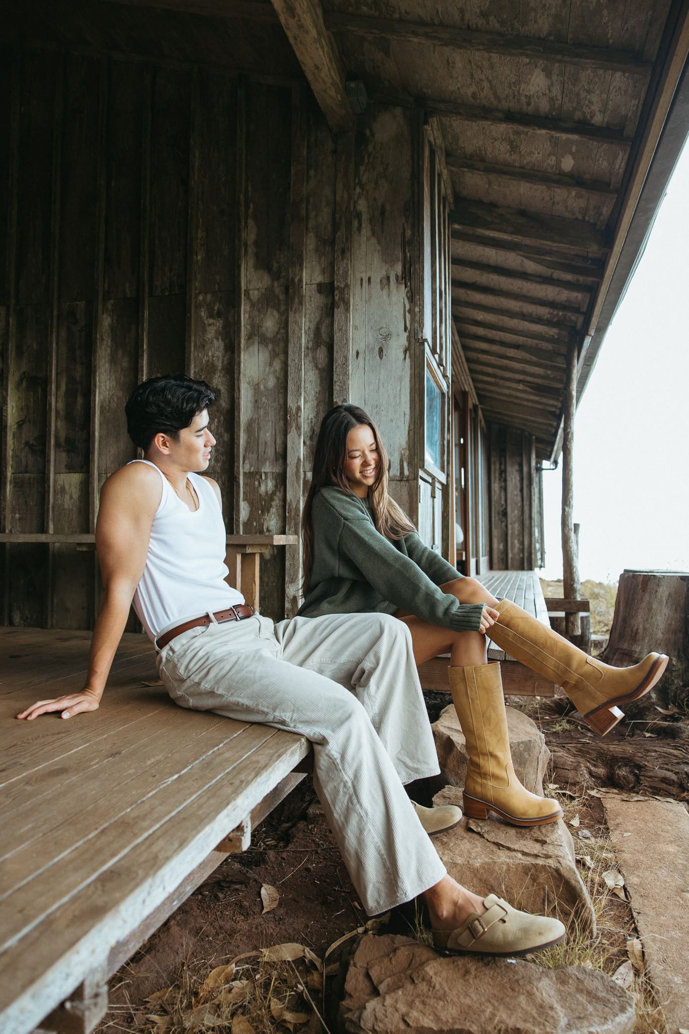 a couple sitting on the porch and talking for a couples session