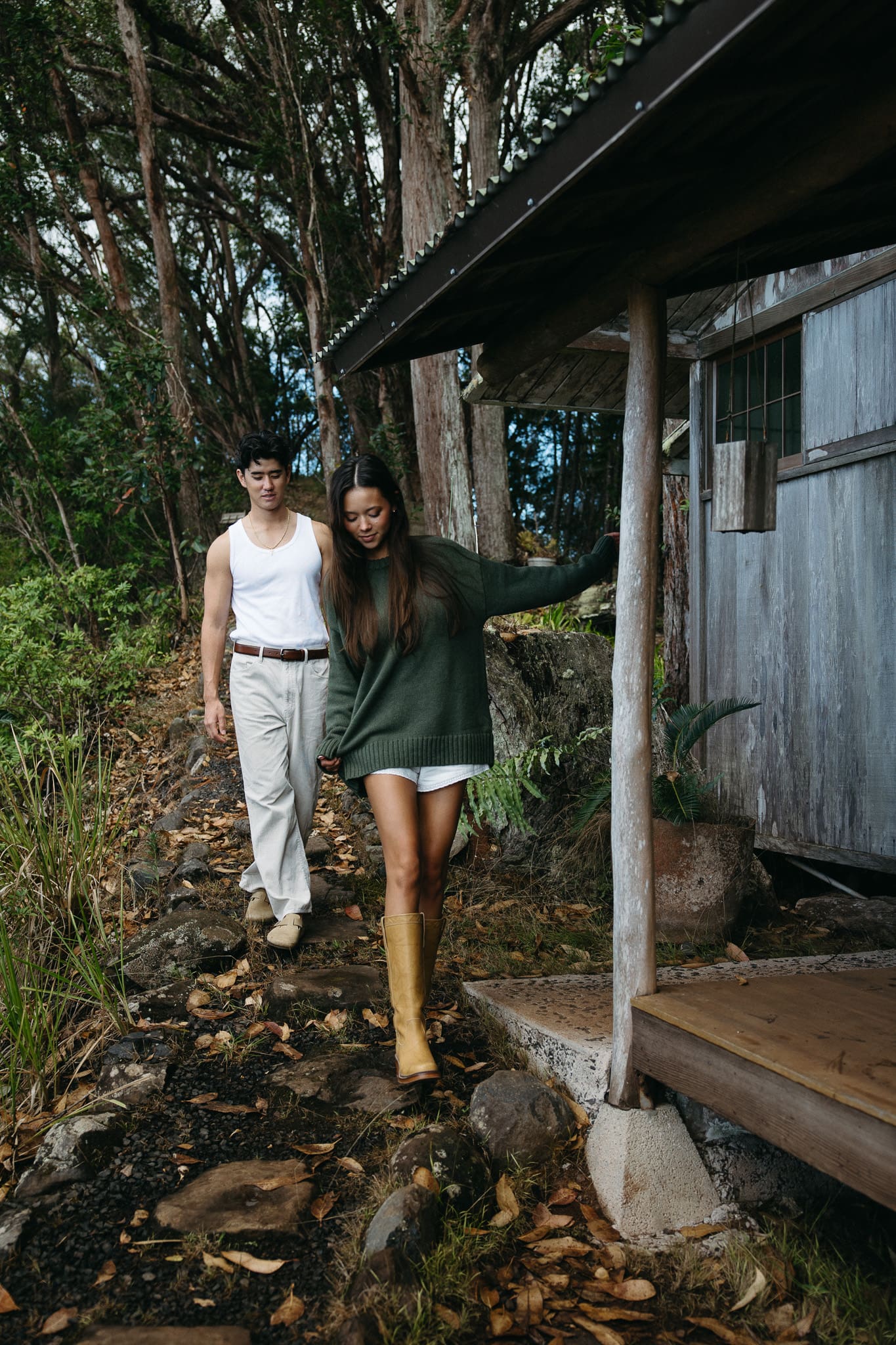 a couple walking by the cottage for a couples session in Montreal 