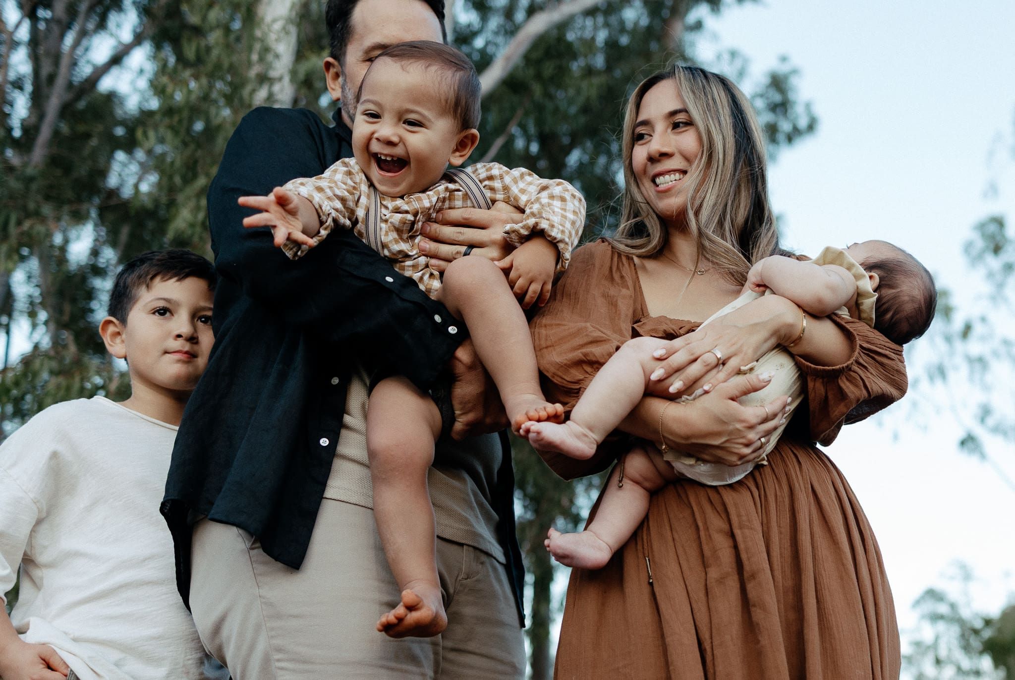 A family laughing for a family photoshoot in Montreal