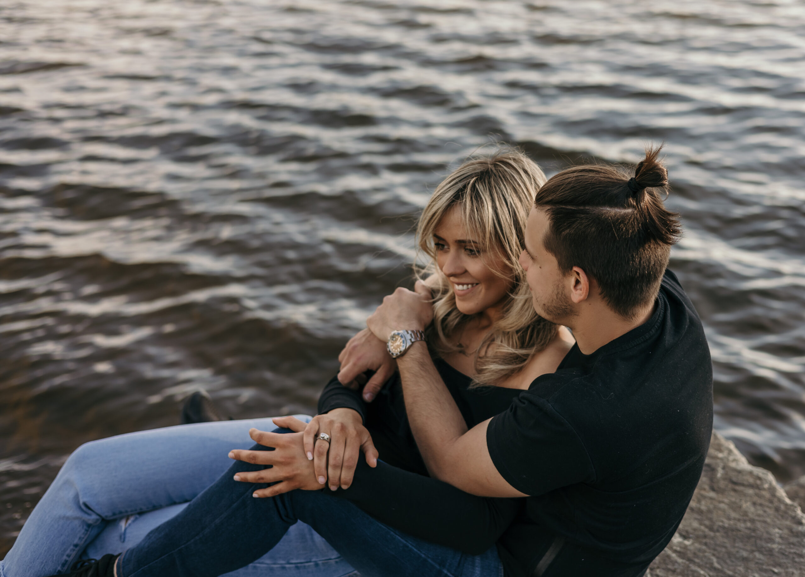 A couple hugging for a sunset photoshoot in Lachine, Montreal