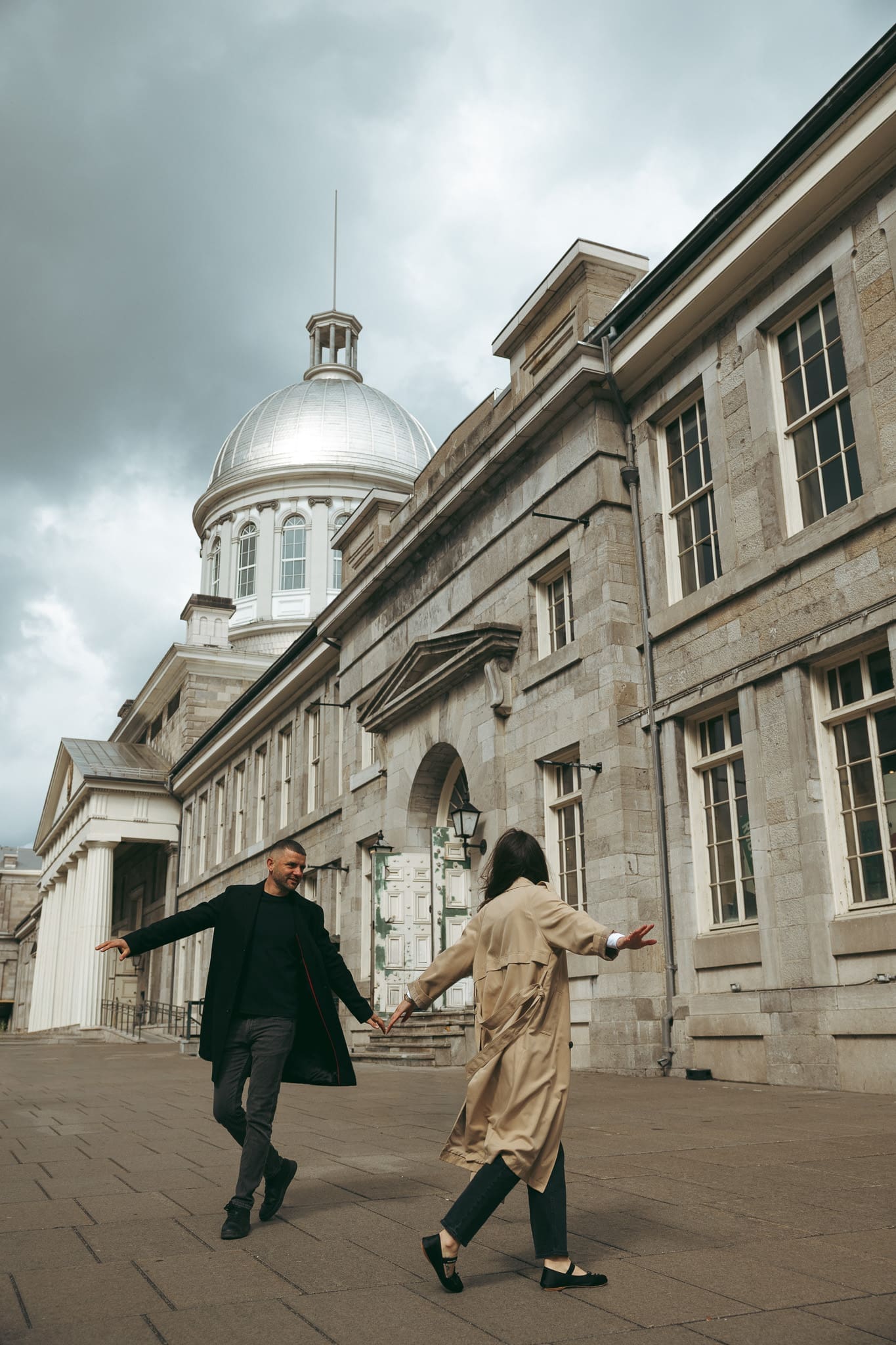 A couple dancing outside Bonsecours Market in Old Port Montreal.