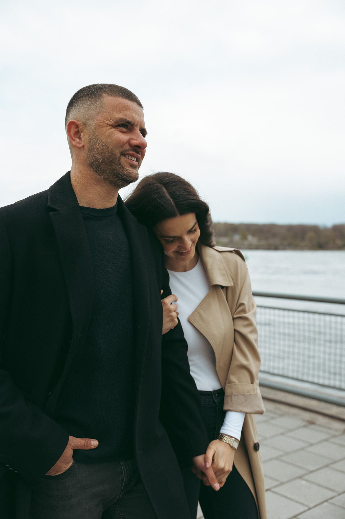 A couple walking and holding hands for a couples photoshoot in Montreal