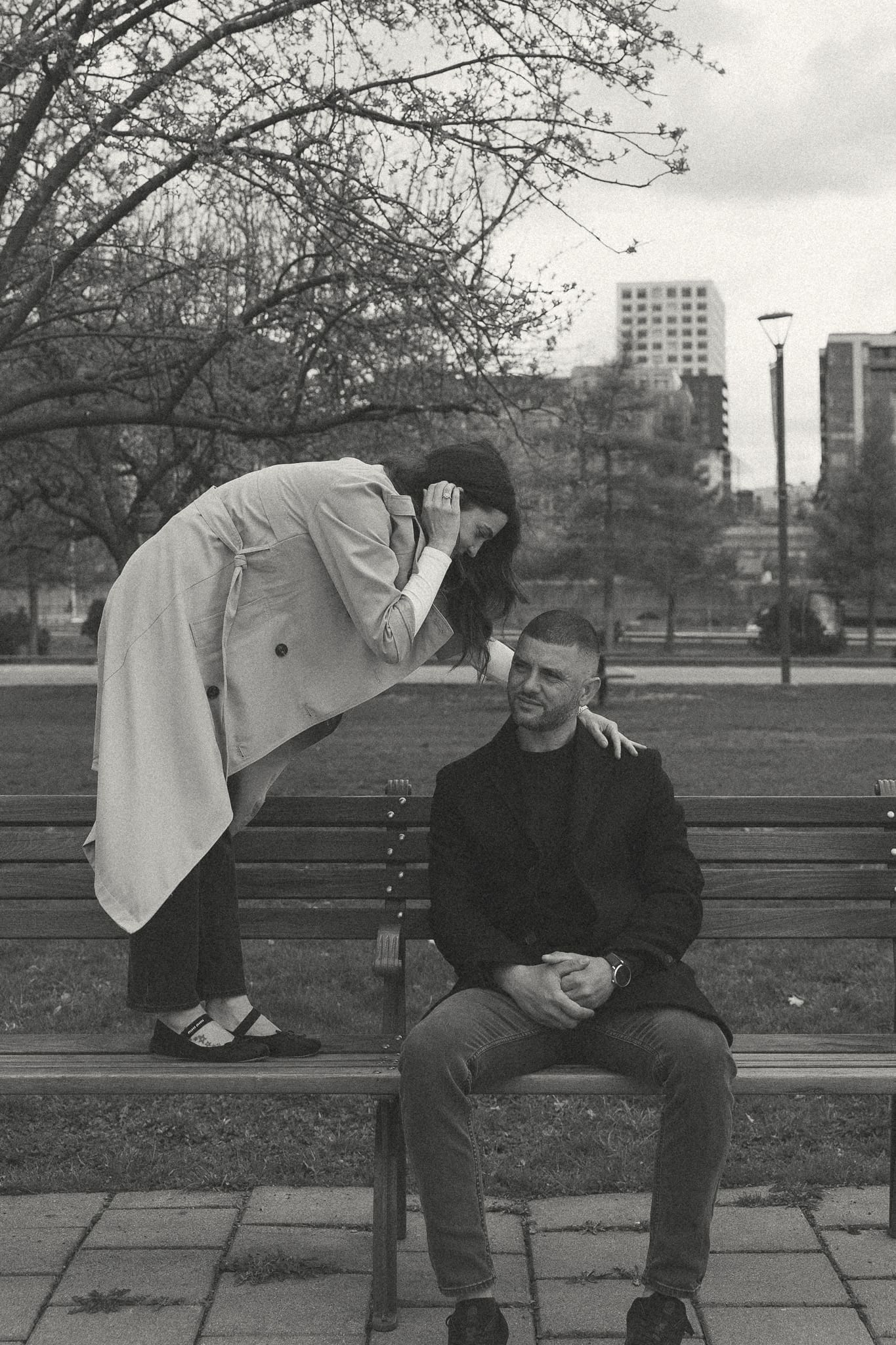 A couple on the bench sitting with each other for a session in downtown Montreal 